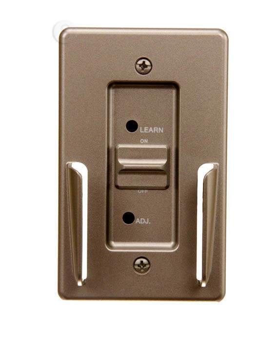 Wall-mounted receiver plate with learn button and adjustment controls