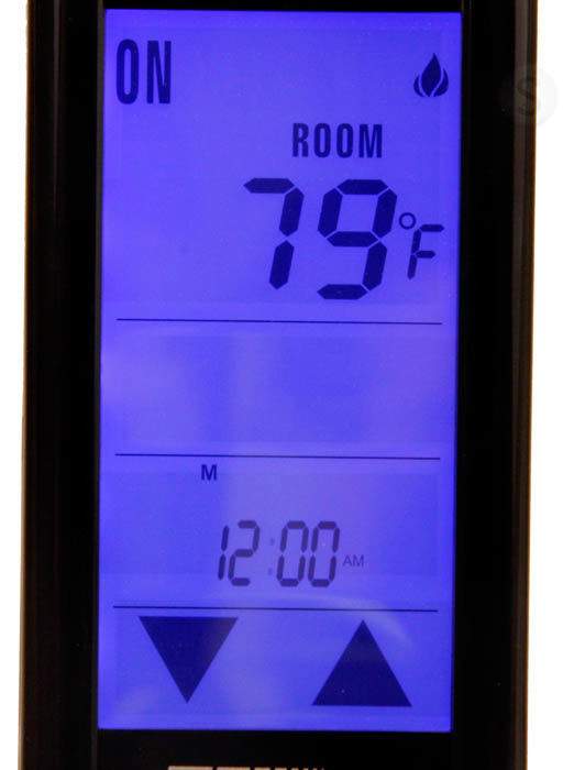 Skytech remote close-up with blue LCD showing ROOM temperature and time
