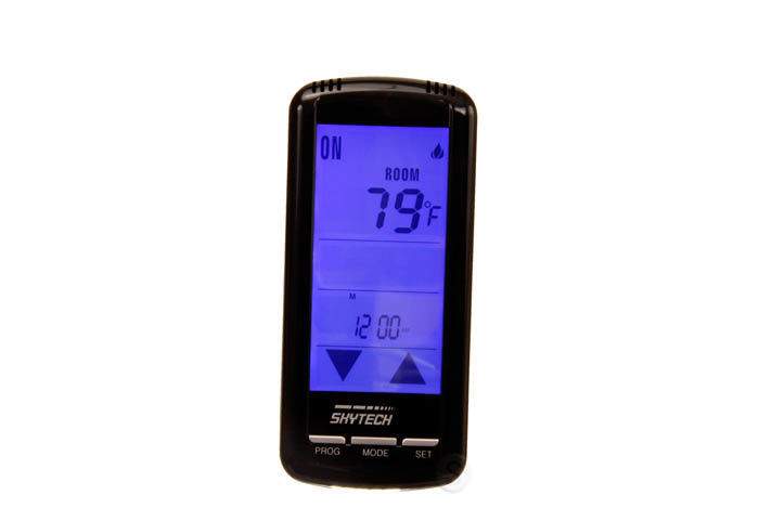 Skytech black thermostat remote with blue LCD showing ON and ROOM temperature