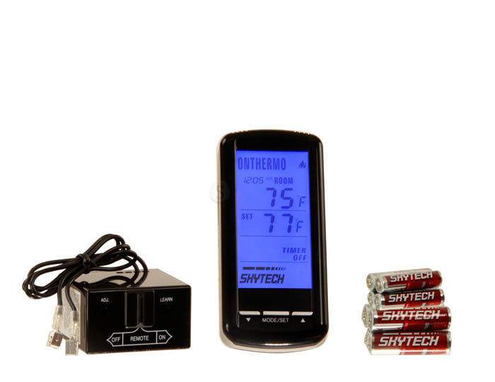 Black fireplace remote control with backlit blue display and cable plus receiver module