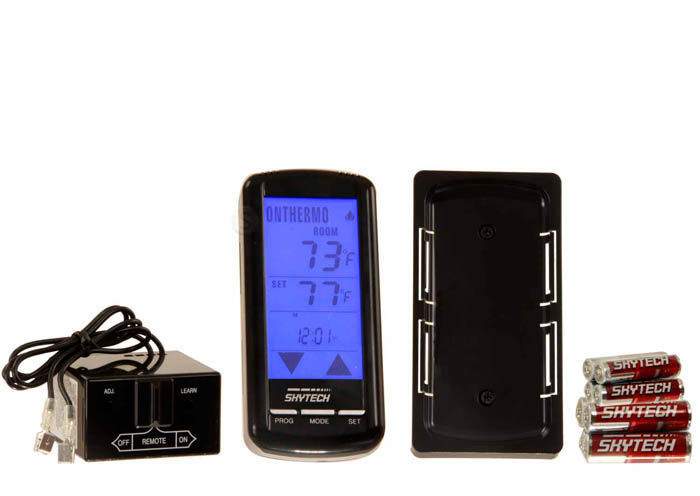 Fireplace remote control with black receiver box, wired connection, and blue LCD display